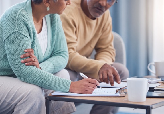 senior couple doing financial paperwork